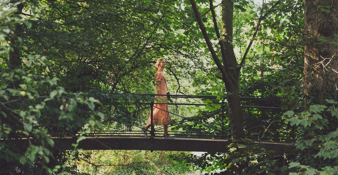 woman standing on bridge