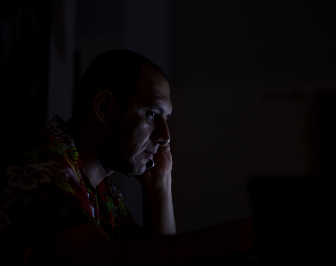 man in red green and white floral shirt