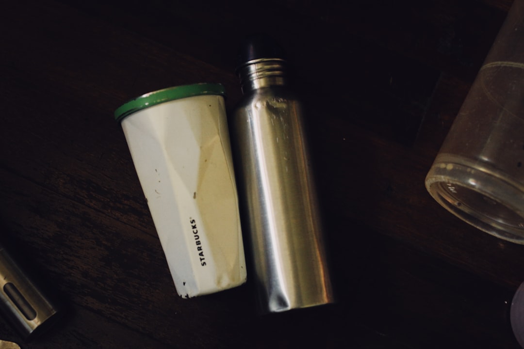 a bottle and a lighter on a table