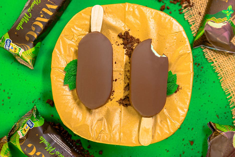 Top view of mint chocolate ice cream bars on a plate with chocolate crumbs, perfect for summer refreshment.