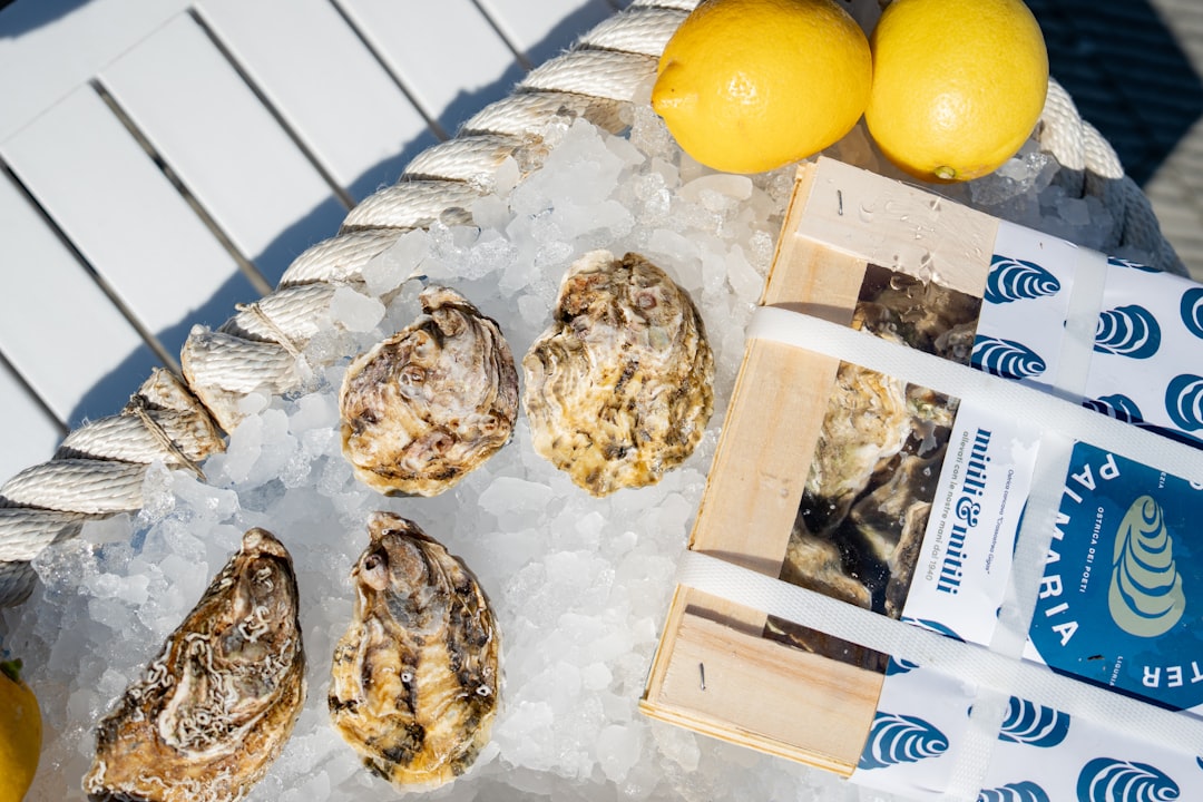 Oysters on ice with lemons ready to eat.