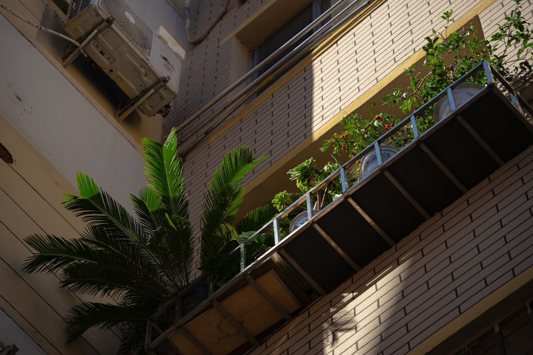 a balcony with a planter on the side of it