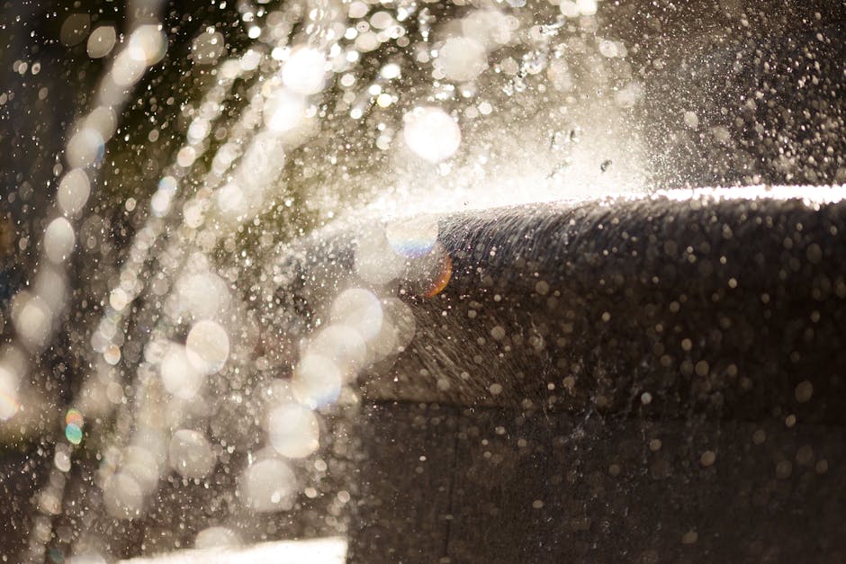 close-up of one spray on fingertip with natural background