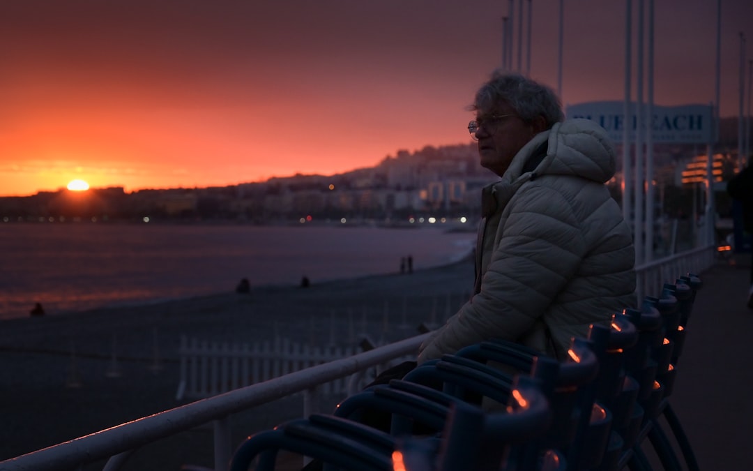 A person observes the sunset over the sea.